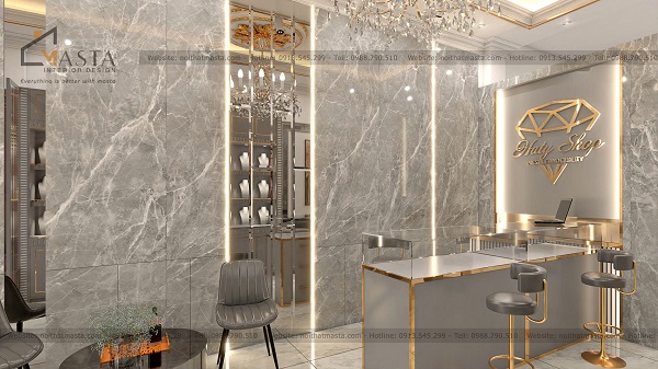Bàn tư vấn và ghế ngồi được thiết kế viền inox mạ vàng nổi bật