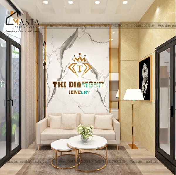 Sử dụng backdrop gợn sóng cùng viền inox mạ vàng, tạo điểm nhấn cho không gian tiếp khách